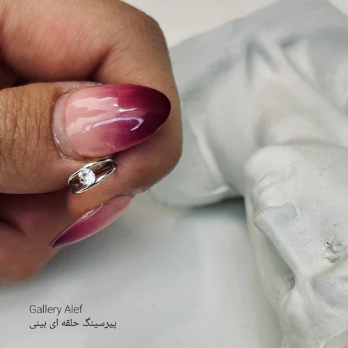 پیرسینگ بینی حلقه ای دولاین نگین دار استیل